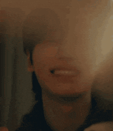 a close up of a person holding sparklers in their mouth .