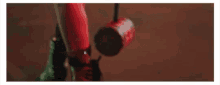 a close up of a person 's feet with a red cup in the background