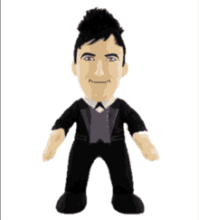 a stuffed doll of a man in a tuxedo with a purple vest