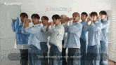 a group of young men are standing in front of a white board with the words our days on it