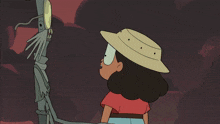 a cartoon of a girl in a red shirt and a hat standing next to a monster