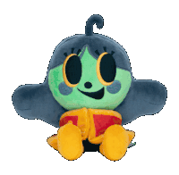 a stuffed toy with a green head and yellow eyes is sitting on a white background