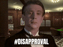a man in a tuxedo says #disapproval