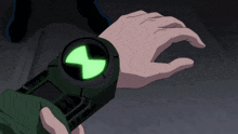 a person is wearing a watch that has a green glowing circle on it