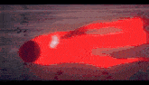 a blurry picture of a person standing in front of a light .