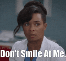 a woman in a lab coat says don 't smile at me