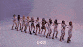 a group of women are dancing in a row with the word choom on the bottom