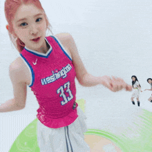 a girl wearing a washington jersey number 33 is dancing