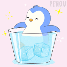 a penguin is sitting in a cup of ice