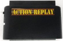 a black action replay cartridge sits on a white table