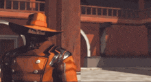 a man in a cowboy hat is holding a large sword