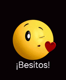 a yellow smiley face with a red heart and the words " besitos "