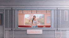 a woman is standing in a train with a sign that says night