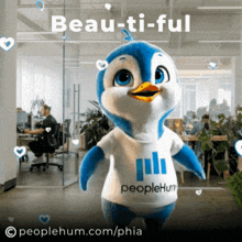 a penguin mascot is wearing a shirt that says peoplehum on it