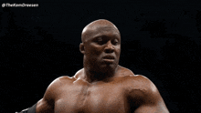 a man without a shirt is standing in front of a black background with the name thekamdreesen on it