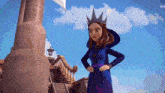 a cartoon character wearing a crown and a blue dress is standing next to a building .