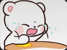a cartoon bear is sitting at a table crying .