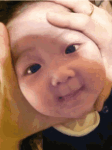 baby squeeze funny face asian