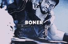 a man with a beard is holding a sword and the word boner is on the bottom of the picture .