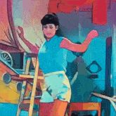 a woman in a blue shirt and white shorts is standing next to a wooden ladder .