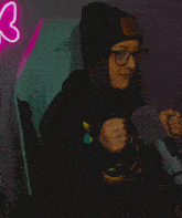 a woman wearing glasses and a beanie that says ' riot years ' on it