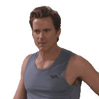 a man wearing a grey tank top with the letter va on it