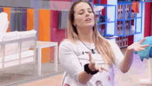 a woman is making a funny face while dancing in a room .