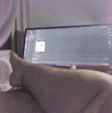 a person is sitting in front of a computer screen