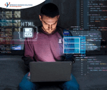 a man is sitting in front of a laptop with html code language displayed on the screen