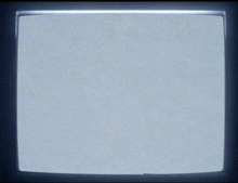 a tv screen shows a gray background with a few white lines