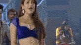 a woman in a blue top with the words now its time to