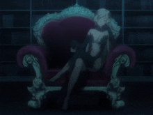 a woman in a black dress sits on a red chair