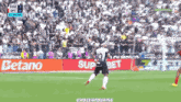 a soccer player with the number 10 on his back kicks the ball