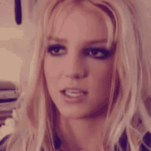 a close up of a woman with blonde hair