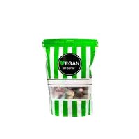 a green and white striped bag of vegan all sorts of candy