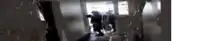 a blurred image of a person standing in a dark room