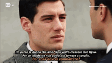 two men are looking at each other with the words ho perso la donna che amo on the bottom