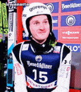 a man wearing a helmet and a shirt that says benedikliner 15
