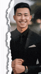 a man in a suit and tie is smiling with a ripped piece of paper behind him