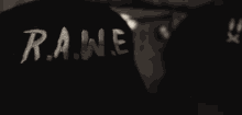 a person wearing a black sweatshirt that says rune on the sleeve