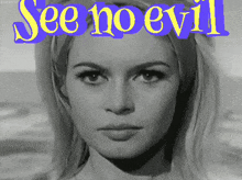 a black and white photo of a woman with the words see no evil