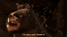 a cartoon bear with a bow on its head says i 'm sexy and i know it