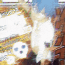 a blurry picture of a person standing next to a brick wall with a skull in the background .