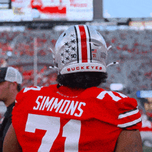 a football player with the name simmons on the back of his shirt