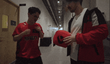 a man in a red shirt that says san on the front