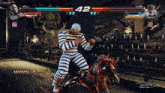 a man in striped pants is fighting another man in a video game with the score 42
