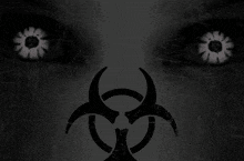 a close up of a person 's eyes with a biohazard sign in the foreground