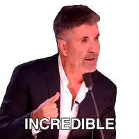 a man in a suit is giving a thumbs up with the word incredible behind him
