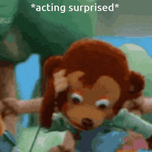 A monkey puppet looking shocked. The text "acting surprised" is written on the top of the image
