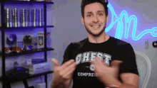 a man wearing a shirt that says chest compress